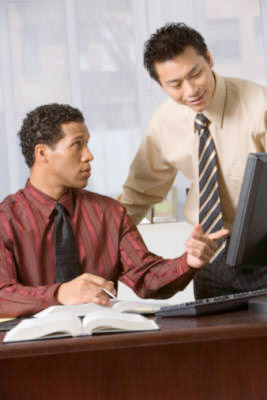 Picture of businessmen looking at computer screen